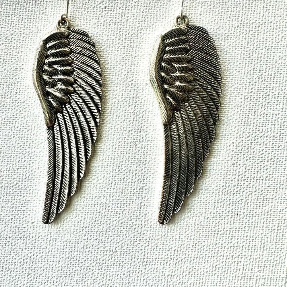 Silver tone angel wing earrings
